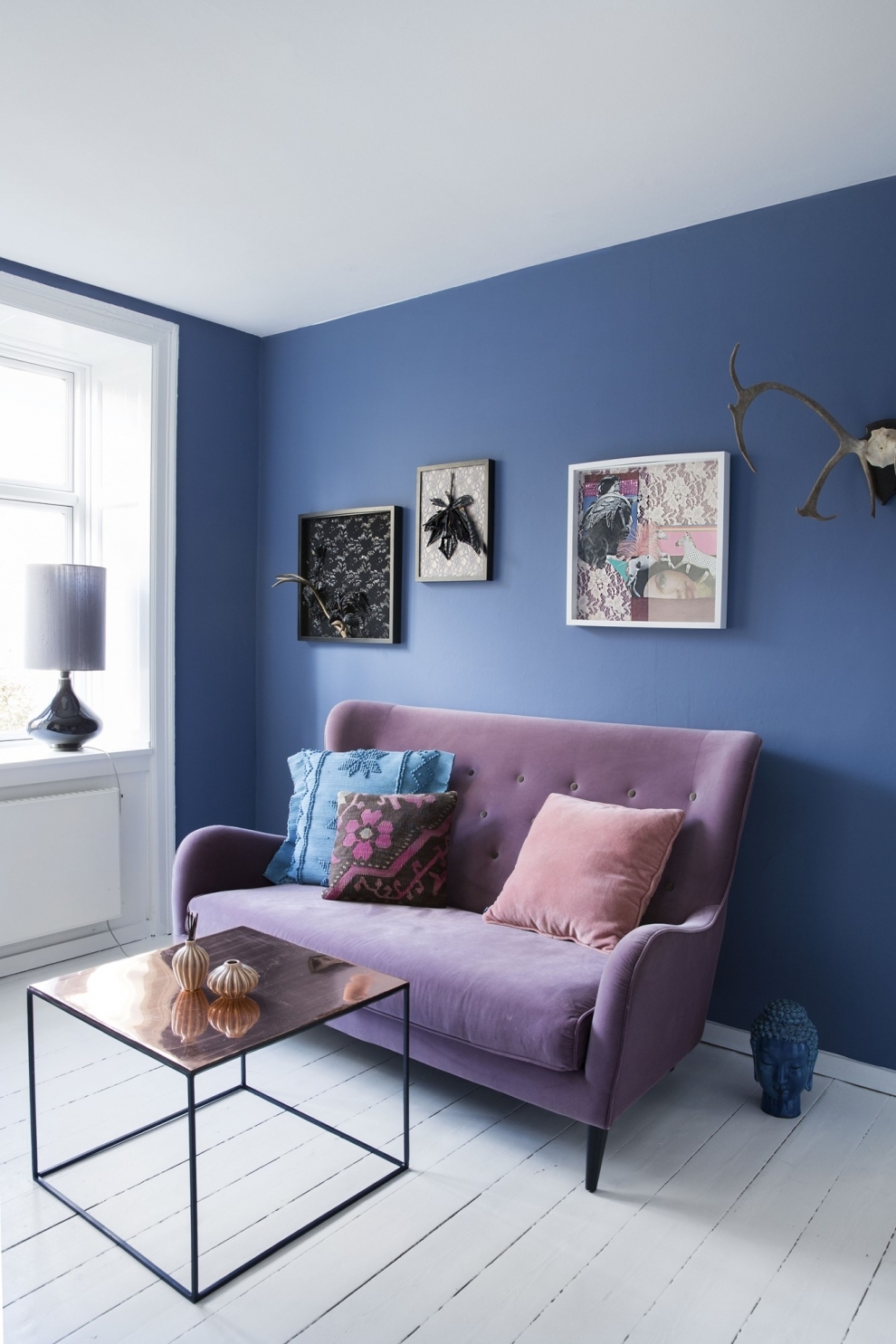 purple sofa blue walls