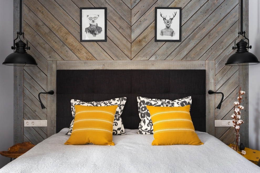 wooden wall behind bed